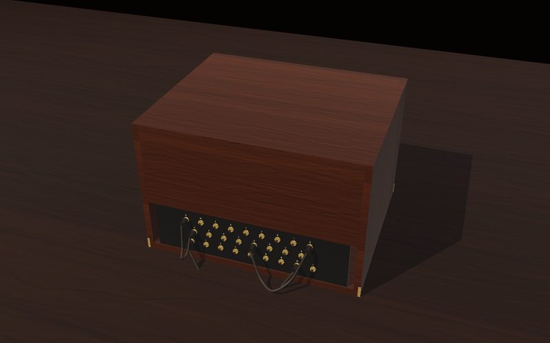 The replica in its closed wooden-look case, plug cables on the front panel.